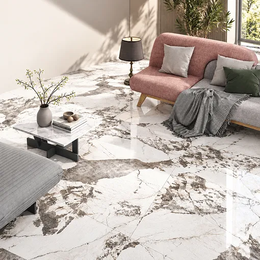 A living room with white and grey marble-look Letoza floor tiles, a sofa and a coffee table