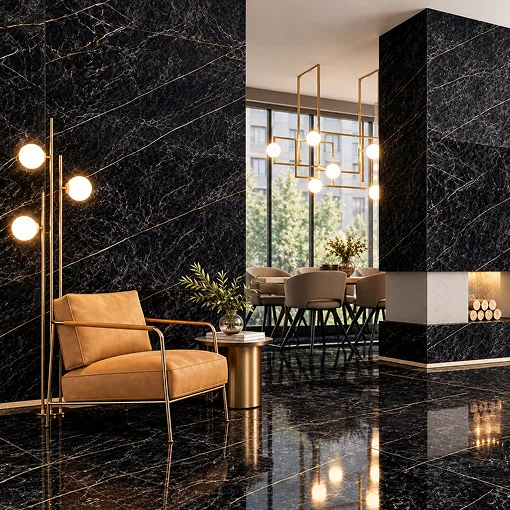 A black marble-look Letoza wall and floor in a lounge with a leather chair and gold pendant lighting