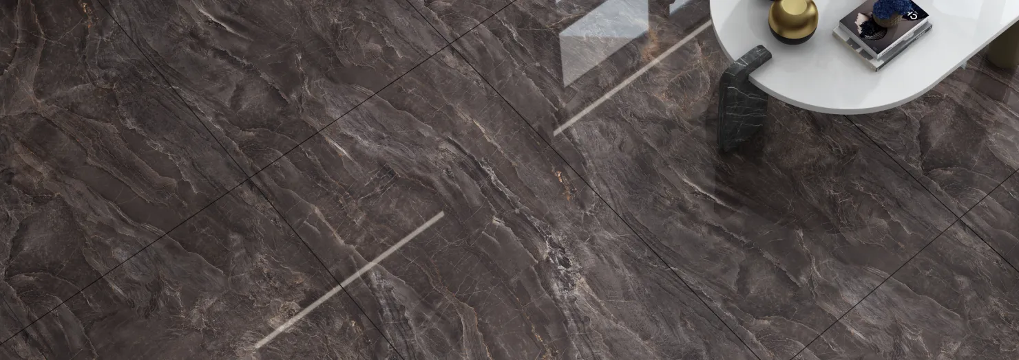 A dark brown marble-look Letoza floor with a round white side table