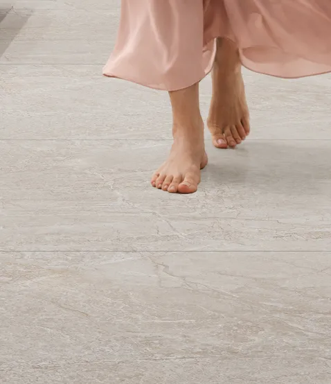 Bare feet crossing a Feather Touch+ floor
