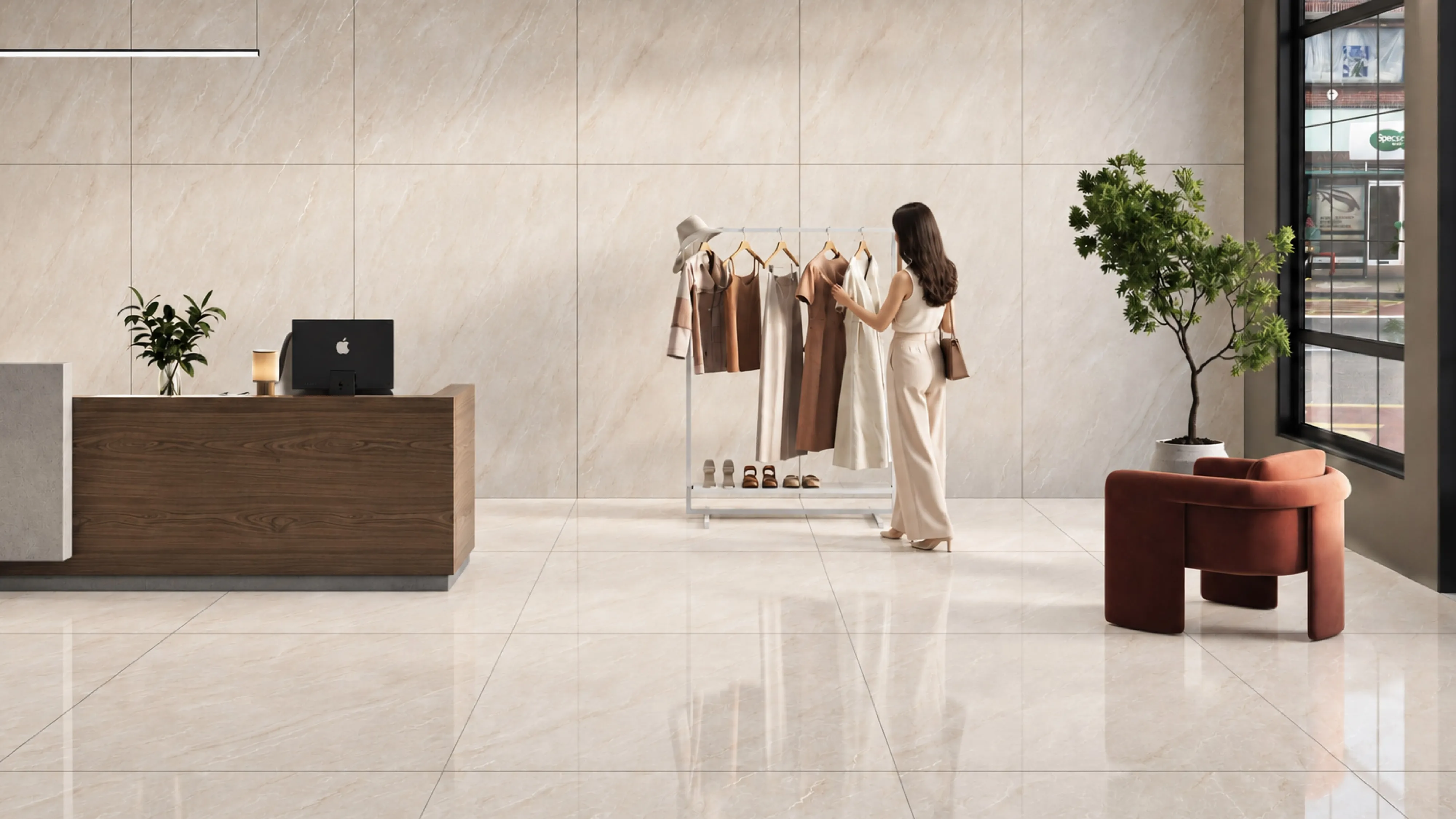 A boutique retail space finished in cream marble-look Letoza tiles, with a wooden counter and a clothing display rack